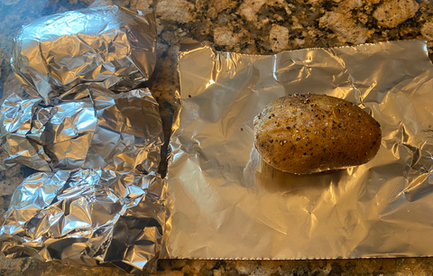 Image of Pull the potatoes out of the oven and wrap in...