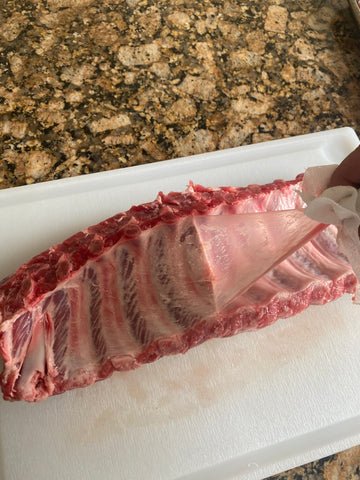Image of Peel the back membrane off the ribs 