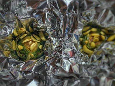 Image of Double wrap each artichoke with 2 layers of heavy duty...