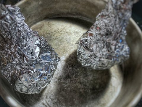 Image of Seal well on top by twisting and pinching foil packets...