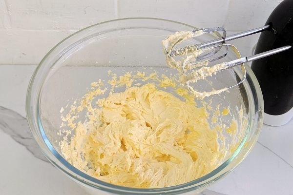 Image of Using electric beaters beat together butter & erythritol. Add egg,...