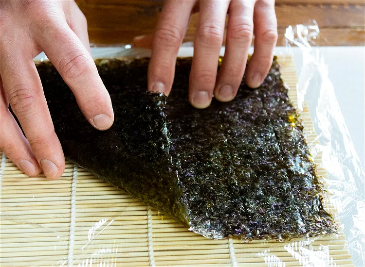 Image of To make the rolls: lay a sheet of nori on...