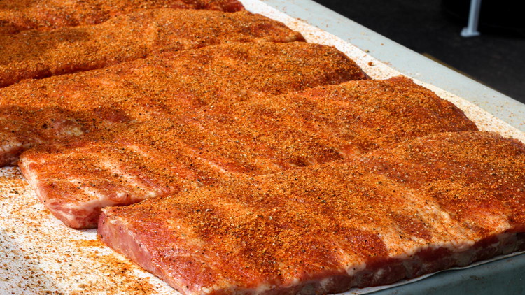 Image of Rub a light amount of mustard over your ribs. Season with Bold & Beefy Seasoning, followed by Sweet & Savory Seasoning. Let sit for around 30 minutes.