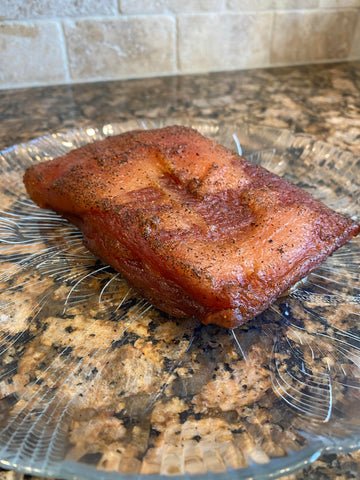 Image of Smoke the pork belly till the internal temperature reaches 150...