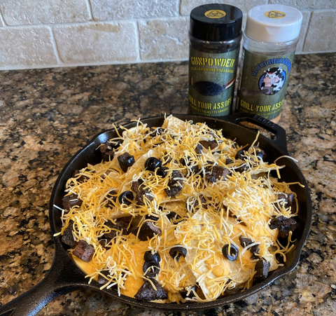 Image of Add steak and olives on top of the chips 