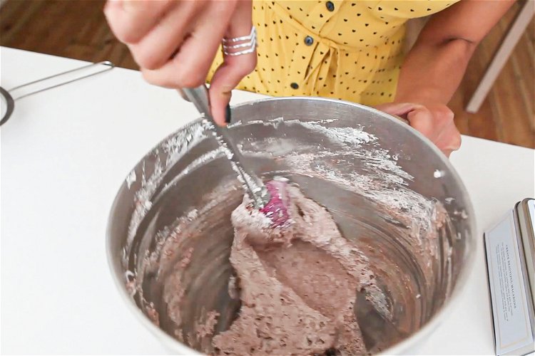 Image of Once the macaron mix is lump free, empty the dry...