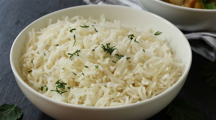 Image of Serve in a bowl with long grain rice and garnish...