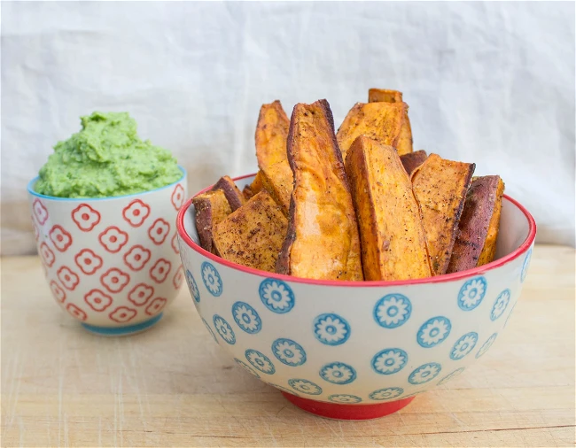 Image of Baked Sweet Potato Wedges With Green Pea & Avocado Dip