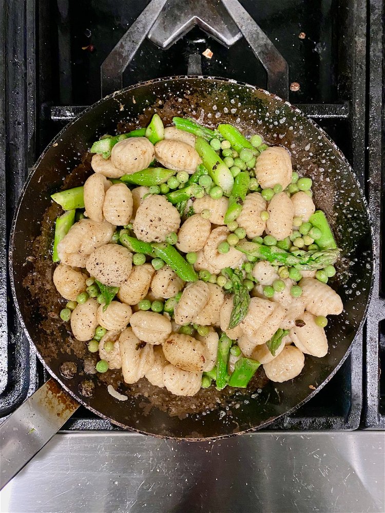 Image of Toss in pan and add 2oz of pasta water. Season...
