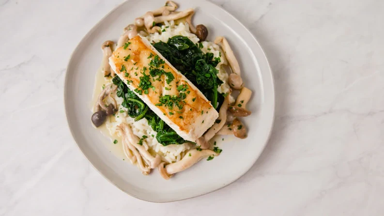 Image of Seared Halibut over Spinach, Mushrooms, and Risotto