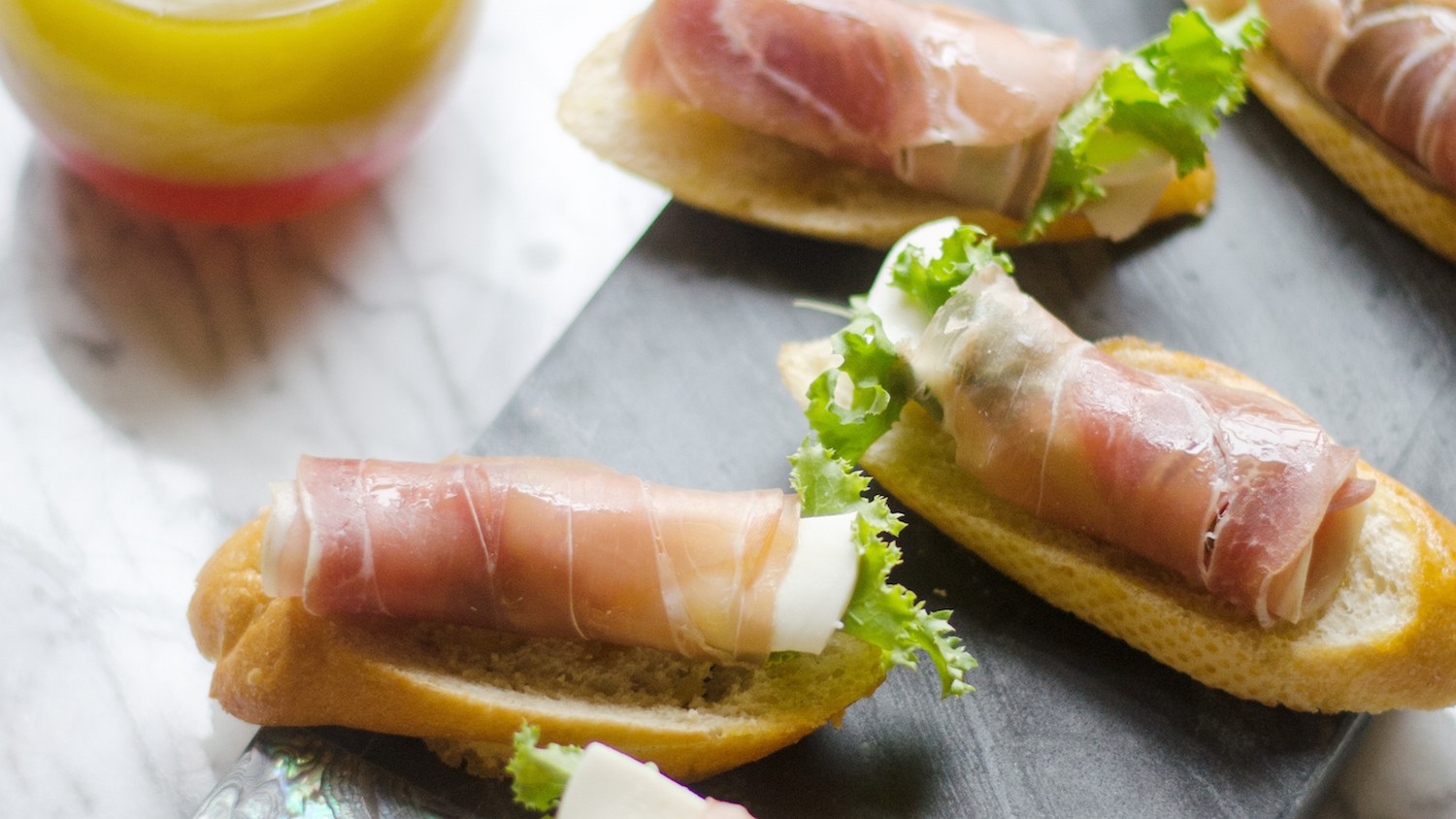 Curly Endive, Prosciutto and Mozzarella on Bruschetta image