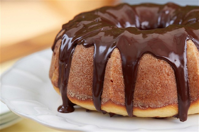 Image of Lemon Bundt Cake with Chocolate Glaze and Candied Lemon