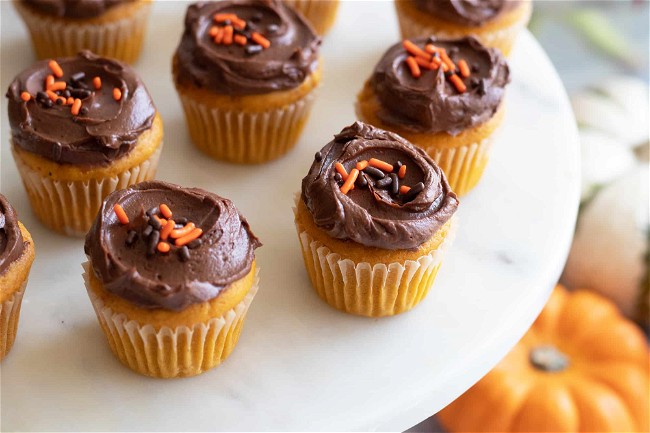 Image of Mini Pumpkin Cupcakes with Chocolate Frosting