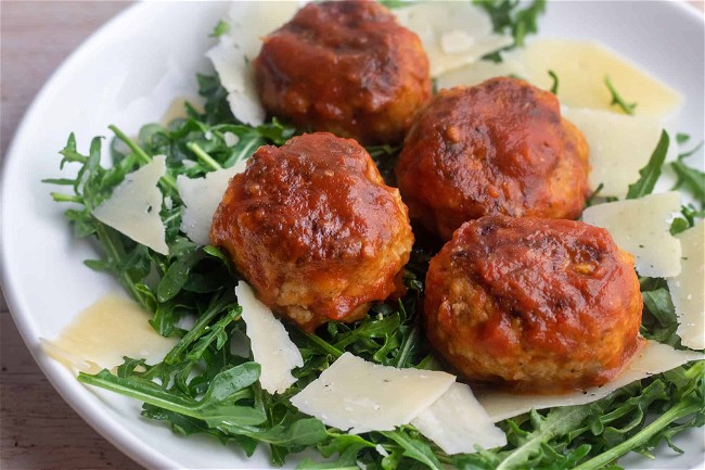 Image of Giada's Pork Meatballs Over Arugula