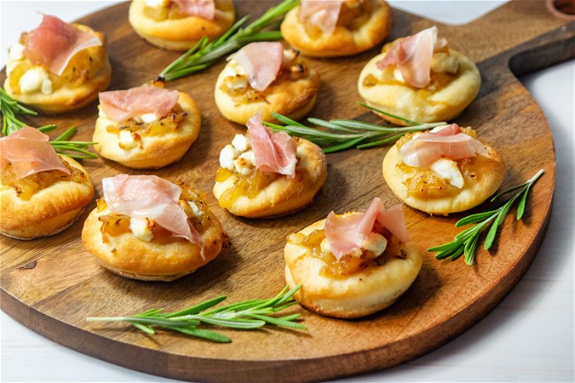 Image of Caramelized Onion and Prosciutto Pizzettes