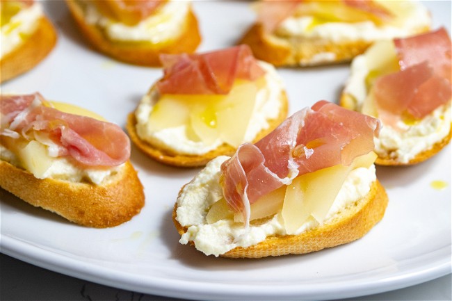 Image of Poached Pear And Prosciutto Crostini