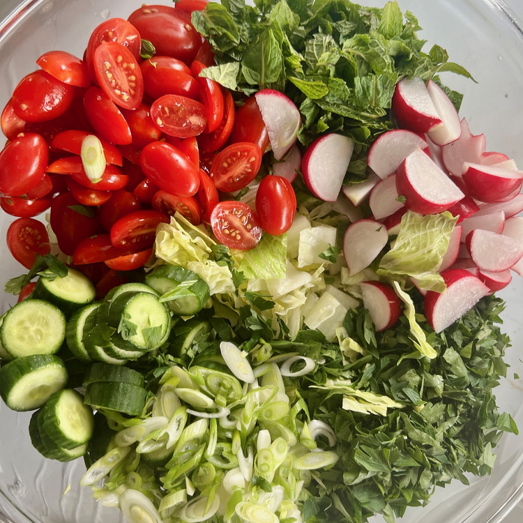 Image of When ready, toss the salad ingredients, sumac vinaigrette, and crispy pita pieces to combine, adjusting seasoning as needed.