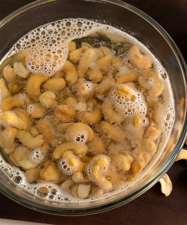 Image of Soak 1 cup of cashews in heatproof bowl allowing the...