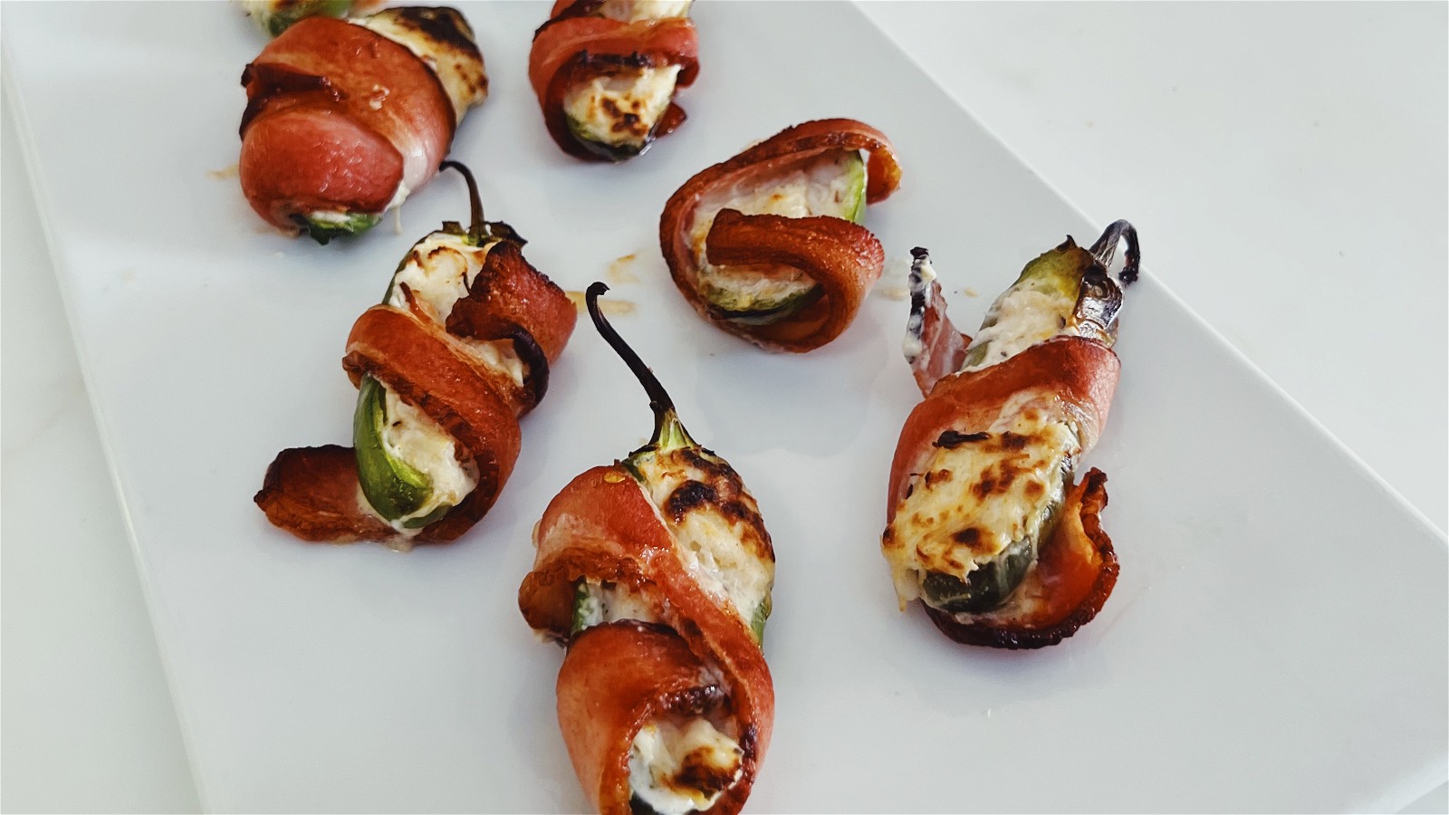 Image of Crab Stuffed Jalapeno Poppers Wrapped in Bacon