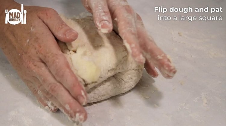 Image of Dump the contents of the bowl onto a floured work...