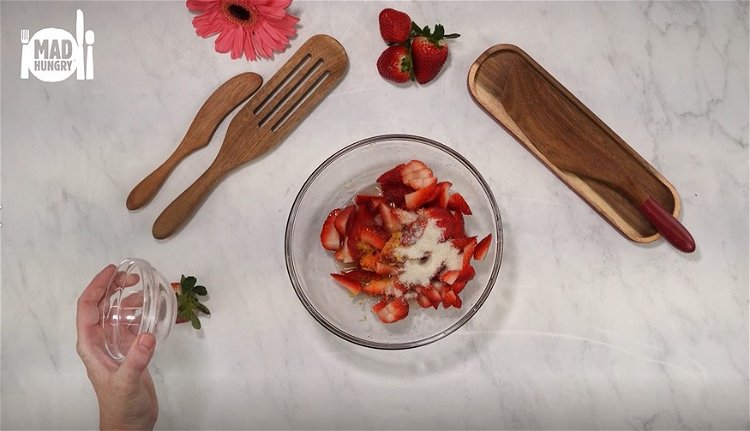 Image of In a medium bowl combine quartered strawberries, sugar, salt, lemon...
