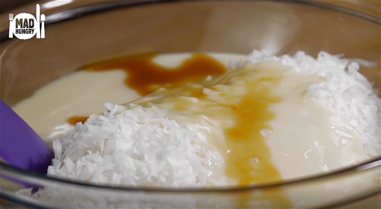 Image of In a large bowl combine coconut flakes, sweetened condensed milk...