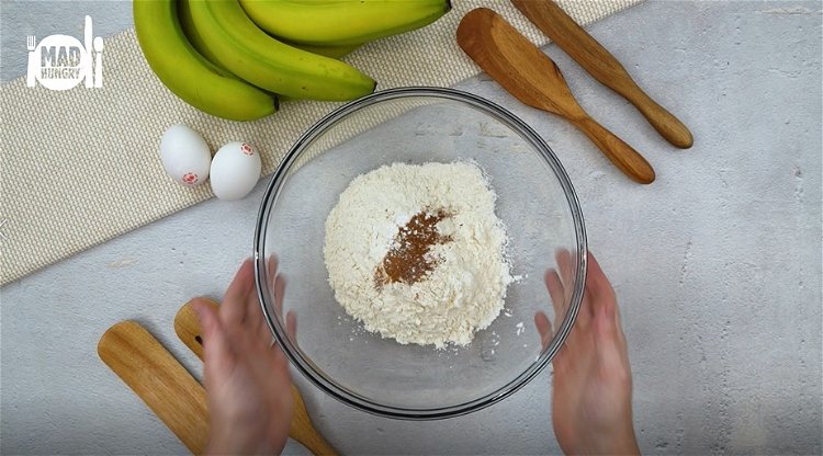 Image of In a large bowl mix together flour, baking soda, cinnamon,...