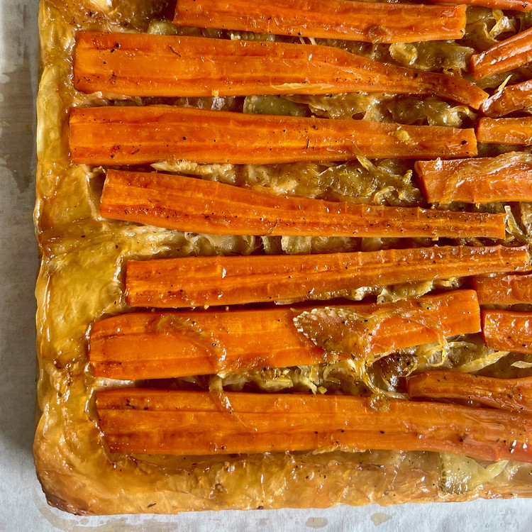 Image of When cooked, remove the trays from the oven and invert the trays so that the dough and carrots are right side up again.