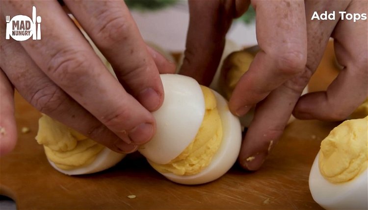 Image of Take the ‘bottom’ of each pair of egg whites and...