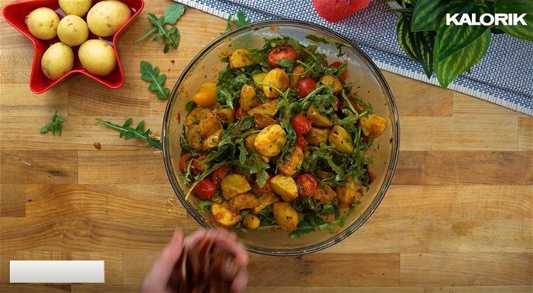 Image of Once the potatoes are fully cooled combine potatoes, tomatoes, arugula,...