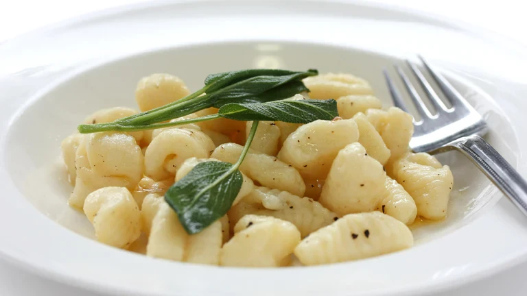 Image of Gnudi with a True Orange-Brown Butter Sauce