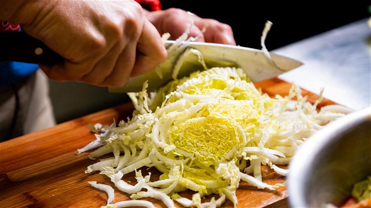 Image of Chop the cabbage into small, thin slices. Add to a...