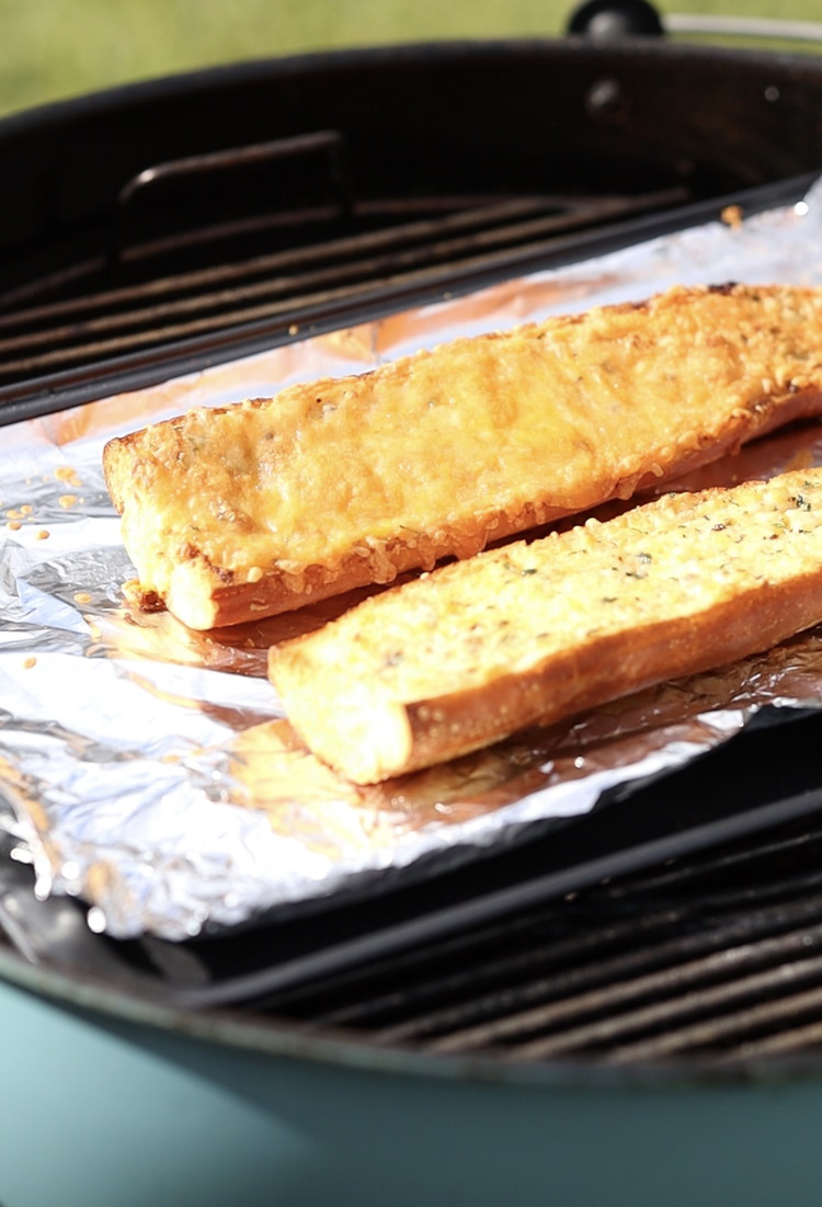 Image of Spread a thick coating of the butter mixture on to your sliced baguettes, and if you really love a cheese kick add an extra sprinkle of cheese over the top.