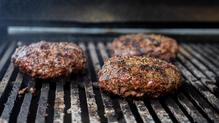 Image of Flip the burgers over and add more Bold & Beefy Seasoning to the other side.