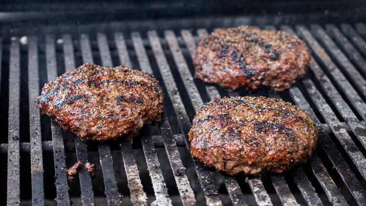 Image of Use a spatula to flip the burgers over. Add more Bold and Beffy to season the other side for boosted flavor. Cook to desired doneness, following this internal temperature guide:Rare - cook for 4 minutes or an internal temperature of 125°FMedium-rare - cook...