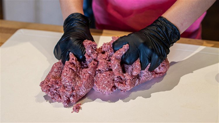 Image of Shape ground beef into 8 large, round patties. 