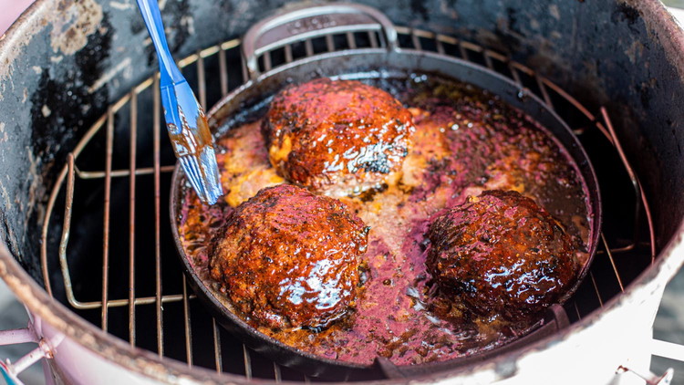 Image of Move burgers from direct heat and into some sort of pan because this is about to get a bit messy. Cover each patty in Raspberry Chipotle Barbecue Sauce. Let the burgers sit in the sauce for 5- 10 minutes to...