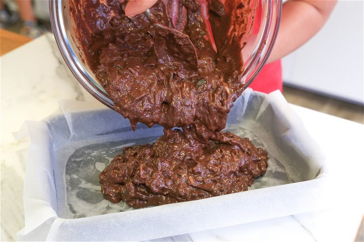 Image of Pour the combined brownie batter gently into the baking tray...