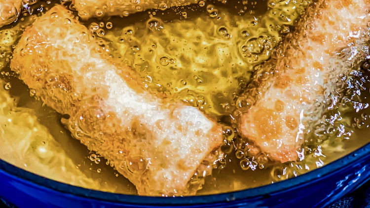Image of Heat peanut oil to 350º. Fry each egg roll for 3-4 minutes until golden brown. Place on a cooling rack once done frying.