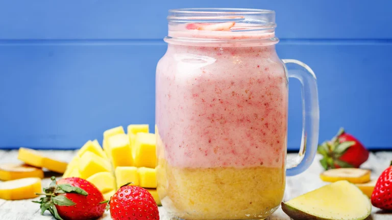 Image of Layered Mango and Strawberry-Banana Smoothie