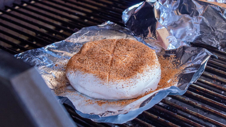 Image of Transfer to smoker and let cook for approximately 2 hours our until the outside reaches the desired color.