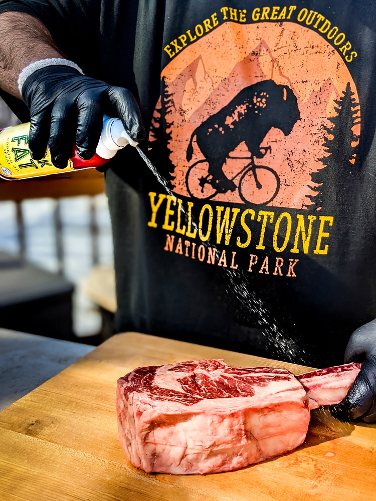 Image of Spray tomahawk ribeye with duck fat spray or brush with olive oil.