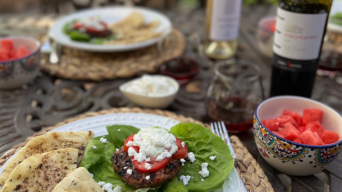 Image of Greek Burgers with Feta, Tzatziki, Tomatoes, and Grilled Naan Bread