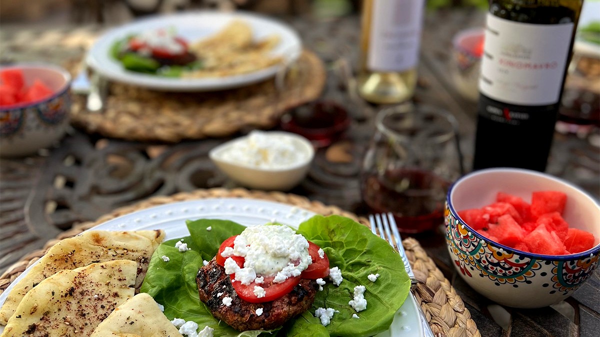 Image of Greek Burgers with Feta, Tzatziki, Tomatoes, and Grilled Naan Bread