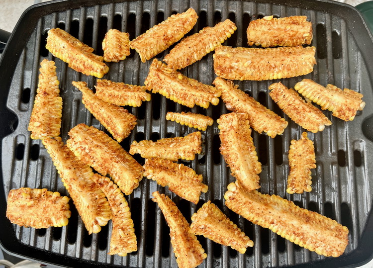 Image of If using the grill, grill the corn ribs until cooked and nicely caramelized.If using the broiler, arrange the corn ribs, cobb side down, and broil until cooked and nicely caramelized.