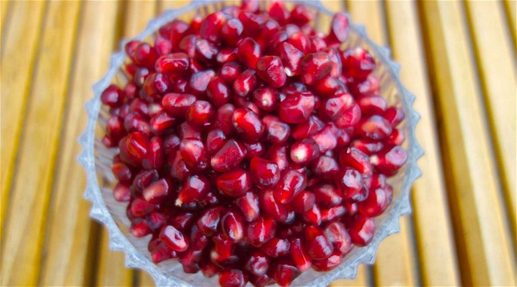 Image of Pop the seeds out of half a pomegranate and sprinkle...