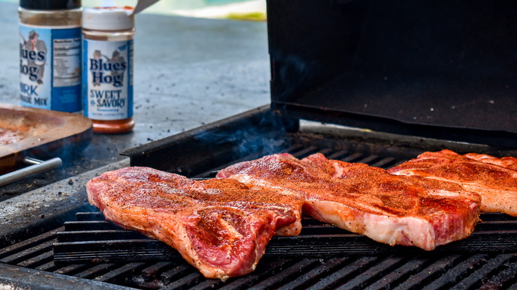Image of On a preheated grill, sear your pork steaks over direct heat for 5-7 minutes on each side.