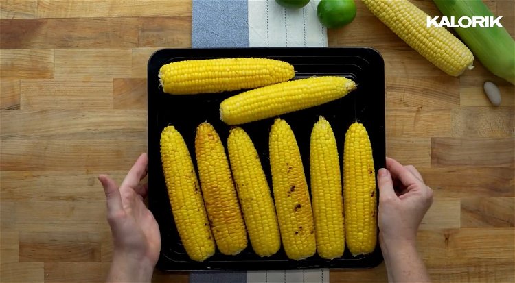 Image of When corn is finished remove from grill and firmly insert...
