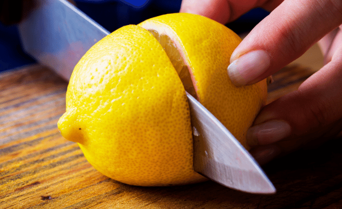 Image of Wash and scrub all your lemons thoroughly then slice them...