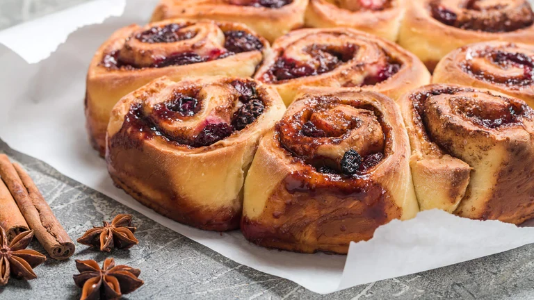 Image of Mixed Berry Jam Scrolls with True Orange Fondant Glaze